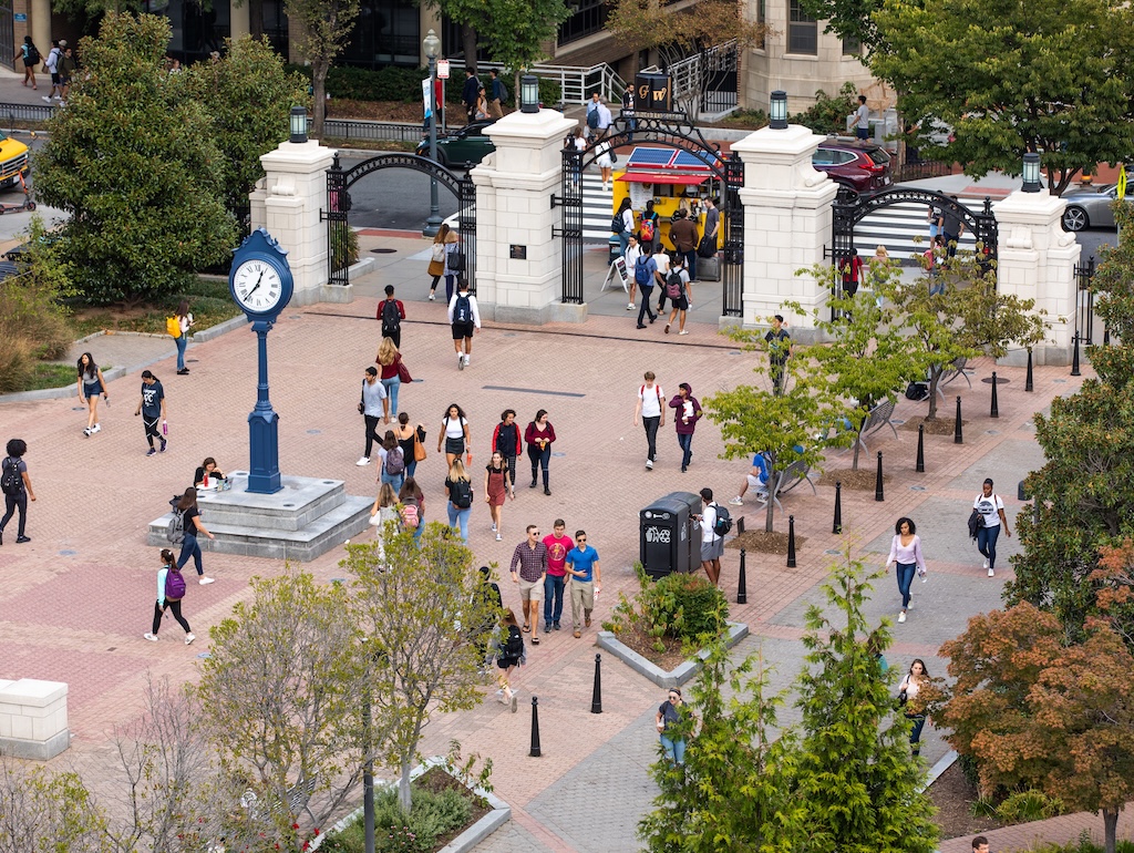 People walking across Kogan Plaza