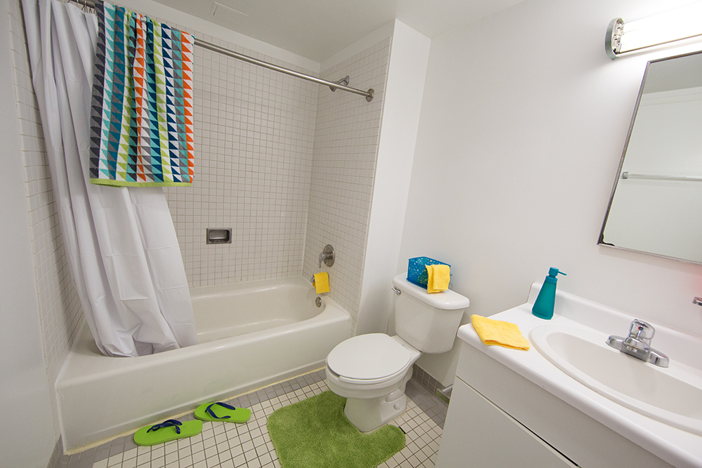 1959 E St. bathroom with single sink and shower-tub.