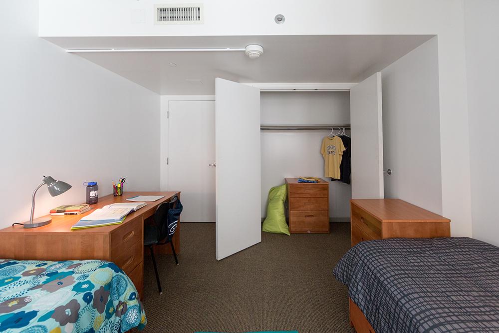 1959 E St., Bedroom with open closet and dresser.